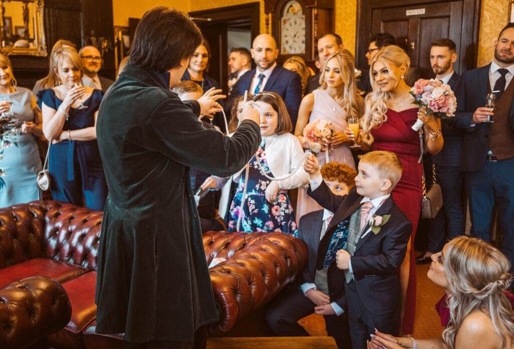 Jay Gatling performing to a roomful of  wedding guests in North Wales. Eriviat Hall.